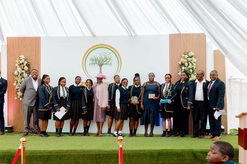 Learners gathered on the branded school stage during prize giving